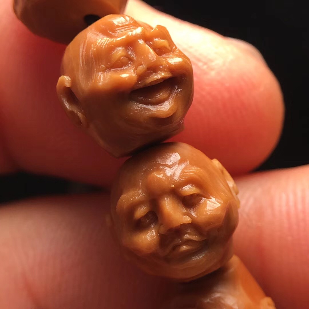 橄榄核雕手串上油盘还是干盘好看,玩文玩橄榄核雕要注意这三点