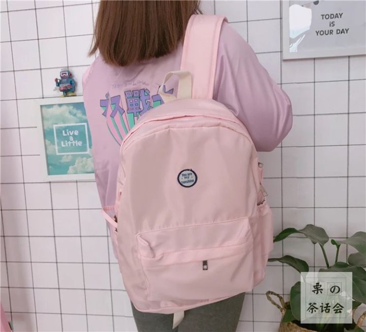 黑色抽绳双肩包出街百搭,双肩包出街推荐大学生小巧