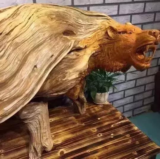 木雕兽头什么寓意,长颈鹿木雕婚礼摆件有什么寓意