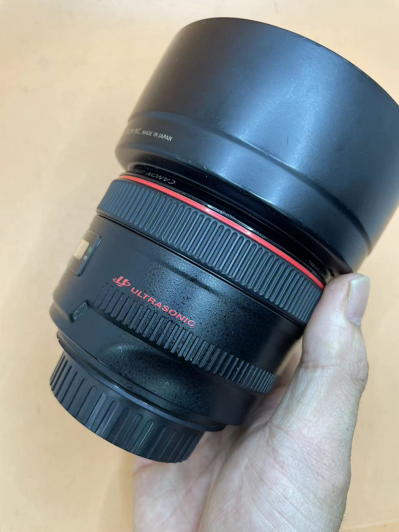 佳能50-1.8二代值得买吗,佳能50-1.2全新的多少钱