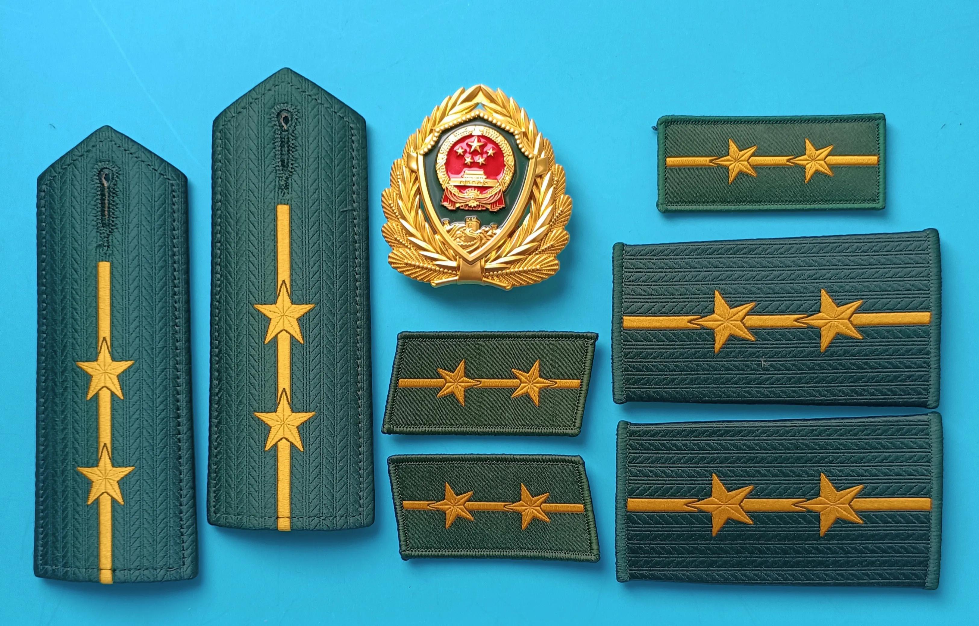 毛启国军装,毛启国警用帽徽